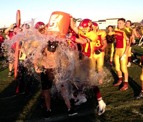 Coach Marini receives the traditional Gatorade bath after the game was put beyond doubt